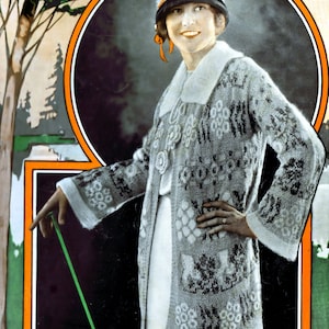 May include: A gray knitted cardigan with a geometric pattern and a white collar. The cardigan has a long sleeve and is worn by a woman with a gray hat.