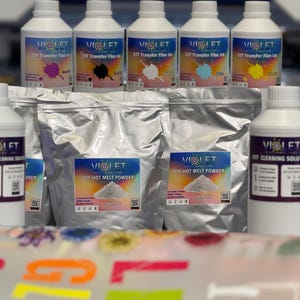 May include: A set of DIY heat transfer supplies including six bottles of colored ink, two bags of white hot melt powder, and two bottles of cleaning solution. The bottles are labeled "Violet" and the bags are labeled "Violet Die Hot Melt Powder".