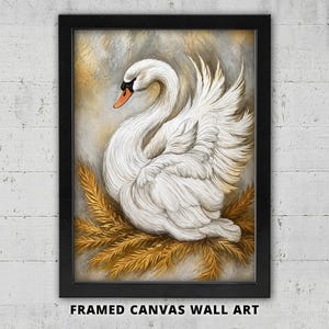 Op de afbeelding: Een ingelijst canvas kunstwerk met een witte zwaan met een oranje snavel, geplaatst tussen goudkleurig, vederachtig gebladerte tegen een gestructureerde, neutrale achtergrond. Het kunstwerk zit in een eenvoudige zwarte rechthoekige lijst.