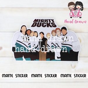 May include: A matte sticker featuring a hand-drawn illustration of the Mighty Ducks team. The sticker shows the team in their hockey jerseys with the text "MIGHTY DUCKS" above them. The sticker also has the text "MATTE STICKER" at the bottom.