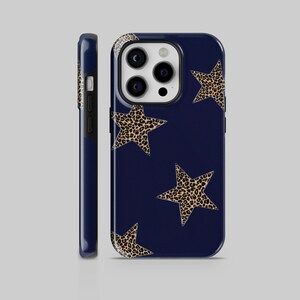May include: A navy blue phone case with a leopard print star design. The case has a cutout for the camera lens.