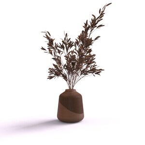 May include: A brown vase with a ribbed design holds a bouquet of dried brown branches.
