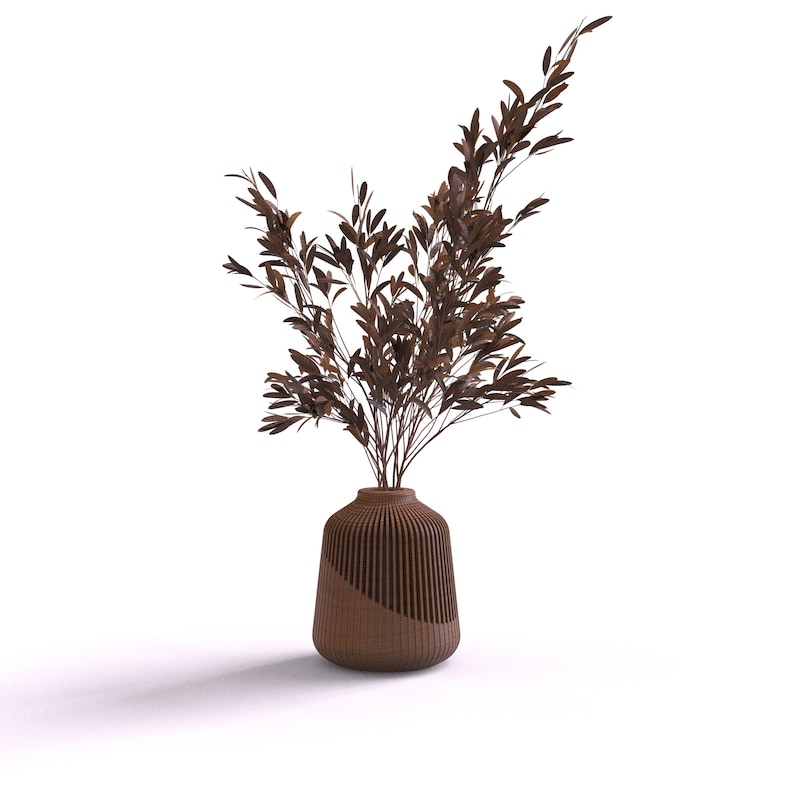 May include: A brown vase with a ribbed design holds a bouquet of dried brown branches.