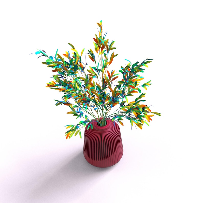 May include: A red vase with a ribbed design holds a bouquet of colorful leaves. The leaves are shades of green, yellow, and blue.