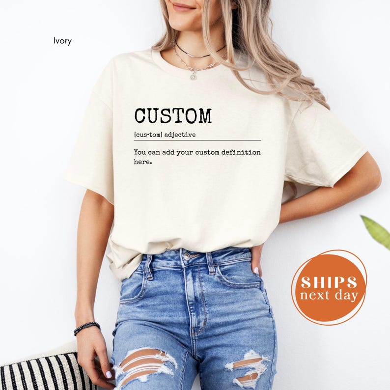 A woman wearing a white t-shirt with the word "CUSTOM" printed on it, standing against a white background.