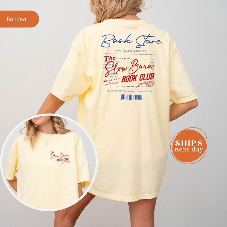 A woman wearing a yellow t-shirt with text and logos related to a book store and a slow-burning book club.