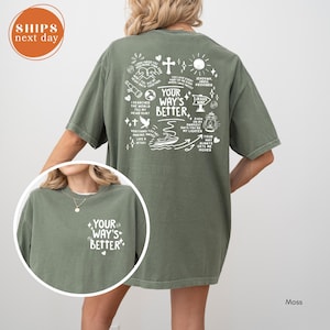 May include: Moss green t-shirt with the text "YOUR WAY'S BETTER" on the front and a detailed white graphic on the back. The back graphic includes religious symbols and phrases. The shirt is a relaxed fit.
