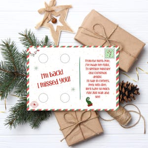 May include: A Christmas-themed postcard with the text "I'm back! I missed you!" and a poem. The postcard is surrounded by wrapped gifts, pine needles, a star ornament, and a pine cone. The postcard has a red and green border.