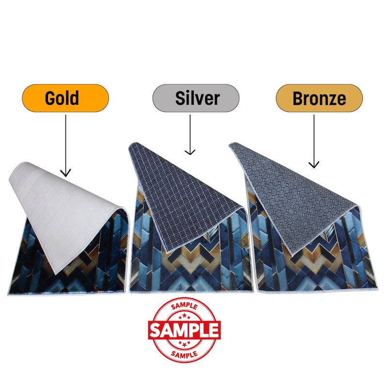 May include: Three rugs with a geometric pattern in blue, gold, and brown tones. The rugs are labeled "Gold", "Silver", and "Bronze". The underside of each rug is visible, with a white, dark blue, and gray pattern. The word "SAMPLE" is stamped on the image.