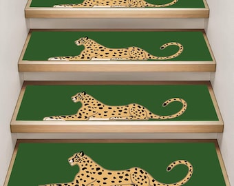 May include: Stair treads featuring a repeating leopard design. Each tread has a dark green background with a tan leopard illustration with black spots. The treads are installed on wooden stairs.