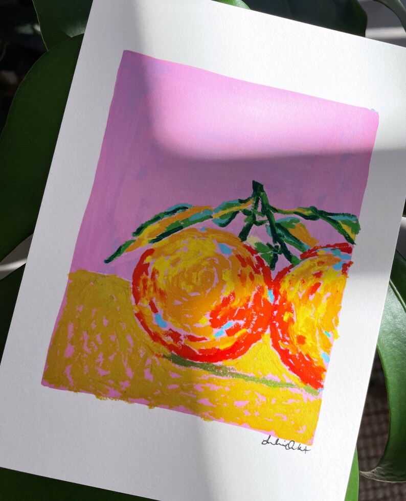 May include: A painting of two oranges with green leaves on a pink background. The oranges are painted in a stylised way with yellow, orange, and red colours.