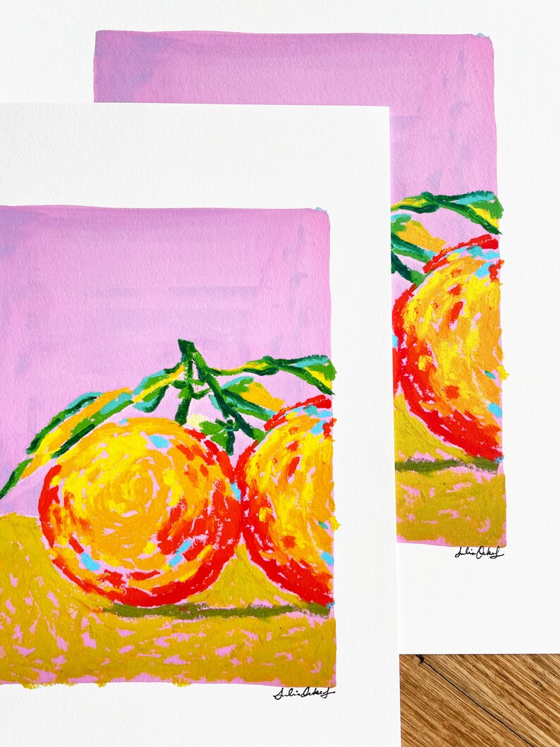May include: Two bright orange fruits with green leaves on a pink background. The fruits are painted in a stylised way with yellow, orange, and red colours. The artist's signature is in the bottom right corner.