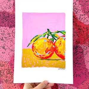 May include: A painting of two orange fruits with green leaves on a pink and yellow background.