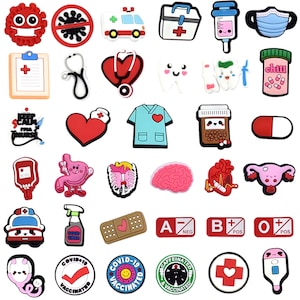 May include: A collection of colorful medical-themed charms. Includes an ambulance, a first aid kit, a stethoscope, a heart with a stethoscope, a nurse's uniform, a brain, a pill, and blood type symbols. Some charms have text like "Good Vibes" and "Vaccinated".