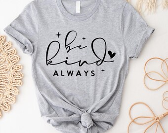 May include: Gray t-shirt with black text that reads "be kind ALWAYS" with a small heart symbol.