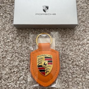 Chaveiro de couro original PORSCHE Crest, corrente, laranja, WAP0500920E