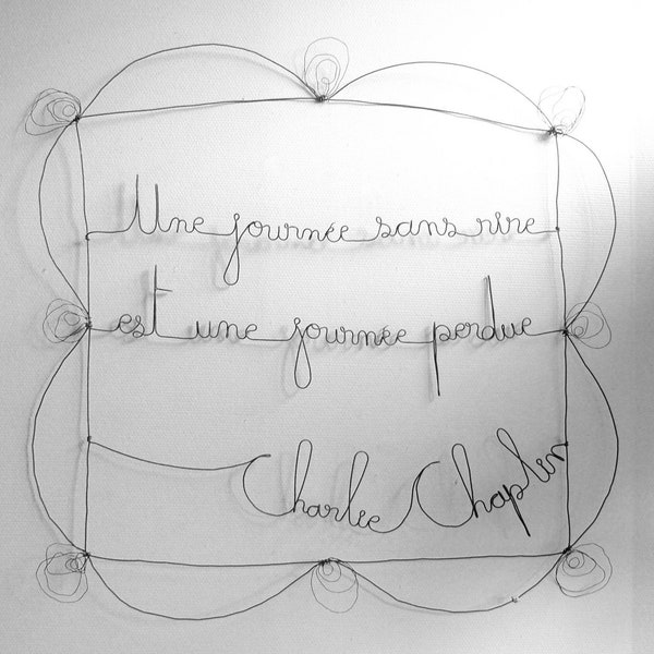 Annealed wire message Charlie Chaplin A day without laughter. Wall decoration, wall phrase - Sculpture, writing, wire quote