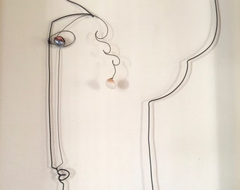 Modigliani-inspired woman profile, articulated eye, shell, wire art