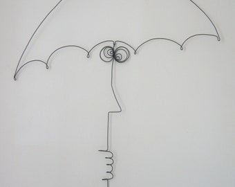 The man under an umbrella inspired by Saul Steinberg, wire art, wire sculpture, wall decoration, one line, the line