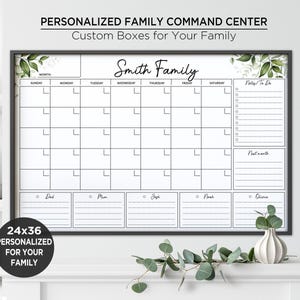 May include: A 61x91 cm personalised family command centre wall calendar with a black frame. The white board features a weekly grid, a notes section, a next month section, and five individual family member rows labelled Dad, Mum, Zeph, Noah, and Olivia.
