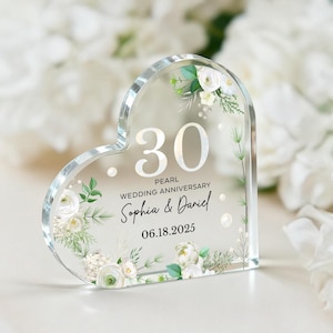 May include: A clear, heart-shaped acrylic keepsake with the number "30" and the words "Pearl Wedding Anniversary." The names "Sophia & Daniel" and the date "06.18.2025" are also displayed. The design includes floral accents.