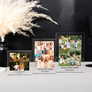 May include: Three clear acrylic photo frames of different sizes, each with a black border and a stand. The frames display collages of photos and the text "YOUR TEXT HERE Text Here" at the bottom. The background is black.