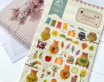 May include: Clear sticker sheet with autumn-themed illustrations. Features cute animal characters, pumpkins, leaves, and the word "FALL" in banner form. Includes text "Autumn fall in the farm story".