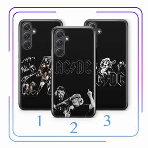 May include: Three black smartphone cases featuring AC/DC band imagery. Case 1 displays band signatures and a logo. Case 2 shows the AC/DC logo above a photograph of band members performing. Case 3 features a graphic of a guitarist and the AC/DC logo.