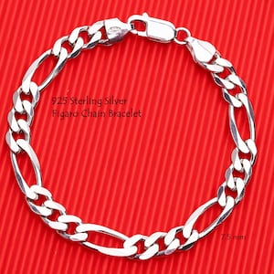 May include: A 925 sterling silver Figaro chain bracelet with a lobster claw clasp. The bracelet features a repeating pattern of three small circular links followed by one elongated oval link. The text 925 Sterling Silver Figaro Chain Bracelet and 7.5 mm are visible.