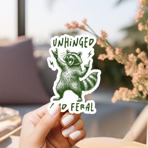Unhinged Raccoon Vinyl Sticker: Funny Feral Chaos Animal Meme