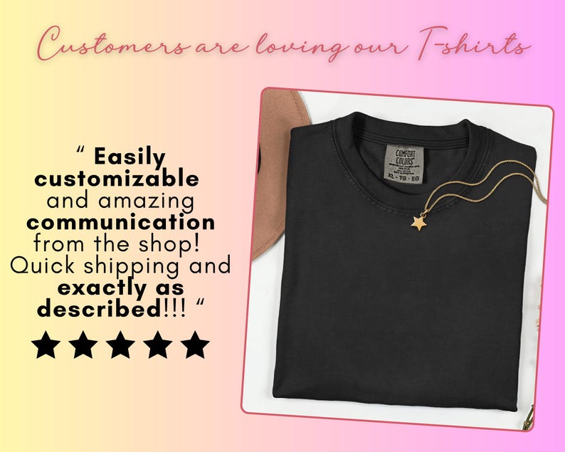 May include: A solid black crew neck t-shirt with a Comfort Colors label in size XL. A gold-toned necklace with a small star pendant rests on the neckline. The image includes text stating Customers are loving our T-shirts and a five-star review.