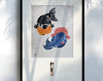 May include: Framed painting of two goldfish, one black and white with orange accents, the other blue with red accents, on a white background. The painting is signed in Chinese characters.