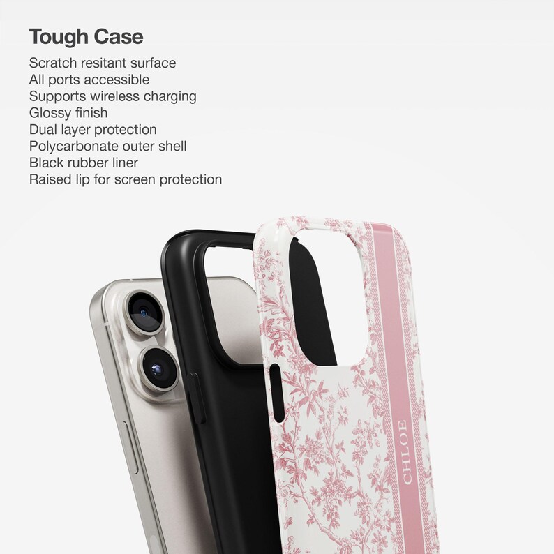 May include: A pink and white floral phone case with a black protective layer and a raised lip for screen protection. The case has the word "CHLOE" printed on the side.