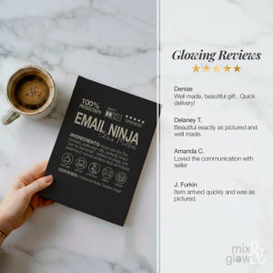 May include: A black notebook with the text "EMAIL NINJA" and "Chris Miller" in silver. The notebook includes icons and text about productivity and ingredients. A cup of coffee sits to the left.