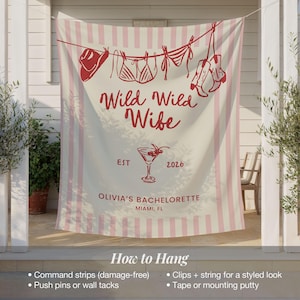Puede incluir: Una pancarta color crema con rayas rosas y texto rojo que dice "Wild Wild Wife" con un gr&aacute;fico de copa de c&oacute;ctel. La pancarta tambi&eacute;n incluye "Olivia's Bachelorette, Miami, FL" y el a&ntilde;o "2026".