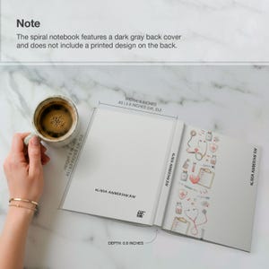 May include: An open spiral notebook with a white interior and a dark grey back cover. The notebook is 20.3 cm tall, 15.2 cm wide, and 1.5 cm deep. The right page has a decorative border with medical-themed illustrations.