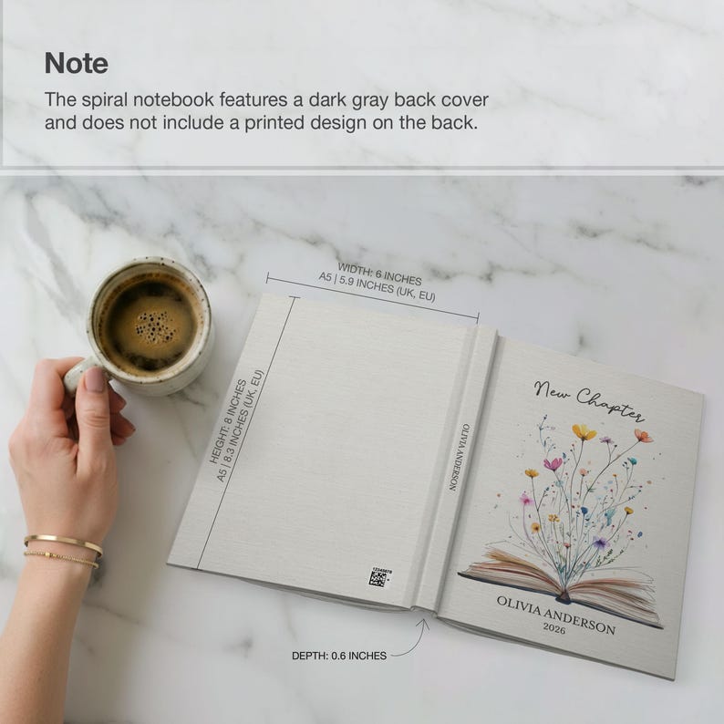 May include: Open notebook with the text "New Chapter" and floral illustrations. The notebook is 8 inches tall, 6 inches wide, and 0.6 inches deep. The cover features the name "Olivia Anderson" and the year 2026.