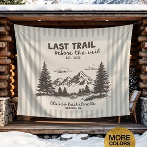 May include: A beige and white striped tapestry with the text "LAST TRAIL before the veil EST. 2026" and "Olivia's Bachelorette SEDONA, AZ". The design includes a mountain and tree illustration.