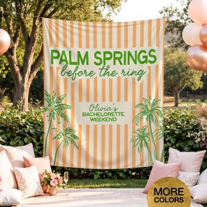 May include: A large, striped backdrop with the text "PALM SPRINGS before the ring" in green. The backdrop also features palm tree illustrations and the text "Olivia's BACHELORETTE WEEKEND". The backdrop is orange and white.