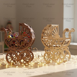 May include: Two wooden baby carriage decorations. One carriage is filled with wrapped candies. The carriages are made of light brown wood and have intricate cut-out designs. The carriages have four wheels and a decorative canopy. The text "CozyLaser Files" is visible.