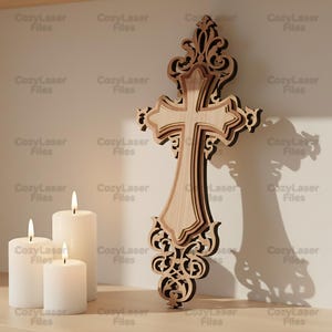 May include: A layered wooden cross with intricate scrollwork and a light wood finish. The cross is displayed with three white candles and the text "CozyLaser Files" repeated in the background.