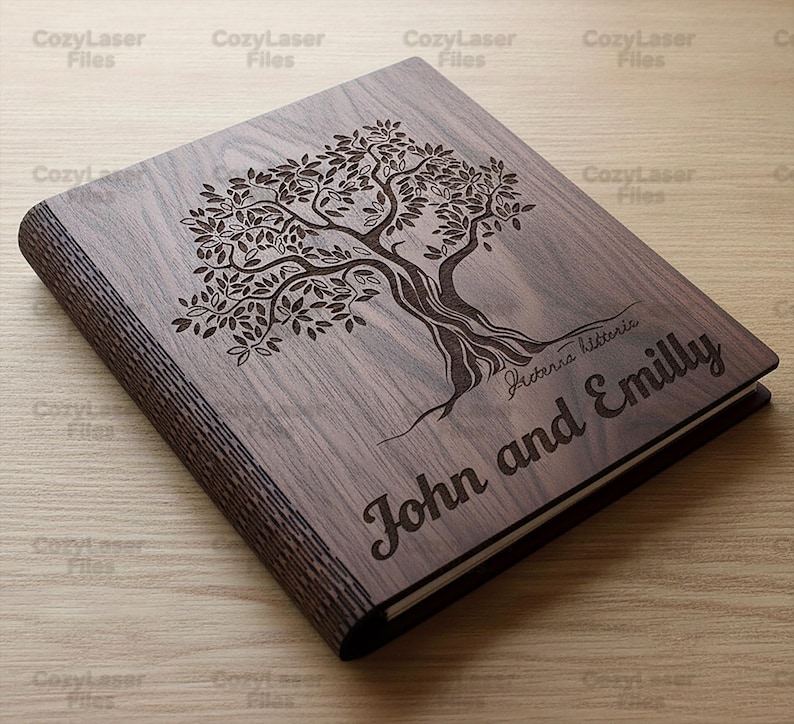 May include: A wooden book with a tree design engraved on the cover. The names "John and Emilly" are engraved below the tree. The book is made of dark wood and has a natural wood grain.