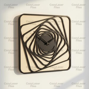 May include: A square wall clock featuring a light beige wooden base and a layered black geometric design that creates a spiraling, tunnel-like effect. The clock has thin black hands centered on the face, with the text CozyLaser Files repeated.