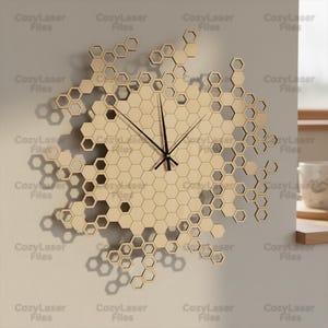 May include: A wooden wall clock with a honeycomb design. The clock has black clock hands and is made of light-coloured wood. The clock is composed of interconnected hexagonal shapes and is mounted on a light grey wall. The text "CozyLaser Files" is repeated around the clock.