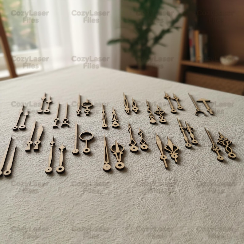 May include: A collection of various wooden clock hands and decorative elements, laser-cut from light-colored wood. The pieces are arranged on a neutral-toned surface, showcasing a variety of shapes and sizes, ideal for DIY clock projects.