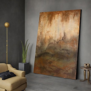 May include: Abstract painting with brown, orange, and green hues. The painting has a textured surface and a layered effect. It is displayed on a wall in a modern interior.