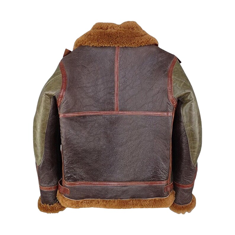 May include: A brown leather jacket with a shearling collar and trim. The jacket features olive green sleeves and red stitching details. The back view showcases the jacket's design and construction, highlighting its vintage style.
