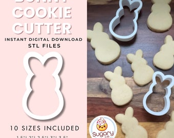 May include: A white bunny cookie cutter with several baked bunny-shaped cookies. The text reads "BUNNY COOKIE CUTTER" and "10 SIZES INCLUDED" with sizes ranging from 1.5" to 6". The image also includes the text "INSTANT DIGITAL DOWNLOAD STL FILES".