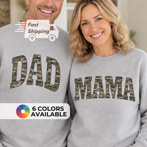 May include: Two grey sweatshirts, one with "DAD" and the other with "MAMA", both in a camouflage design. The left sweatshirt has "Fast Shipping" and a van graphic. The bottom left corner shows "6 COLOURS AVAILABLE".