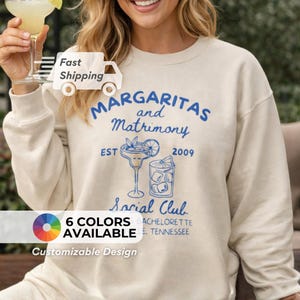 May include: A white ceramic mug with a black handle and the text "But First, Coffee" in a handwritten style. The mug is likely 11 ounces in size, perfect for a morning beverage.